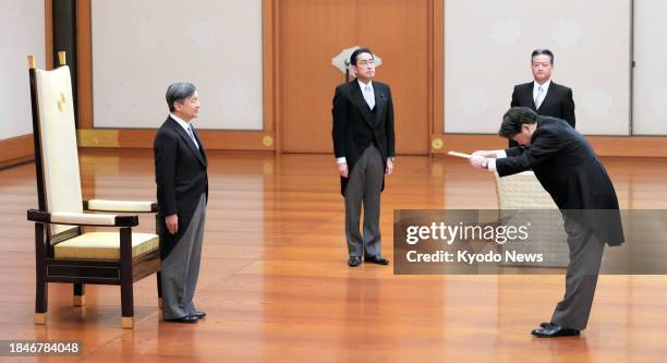 Japan's new Chief Cabinet Secretary Yoshimasa Hayashi attends an attestation ceremony with Emperor Naruhito at the Imperial Palace in Tokyo on Dec....