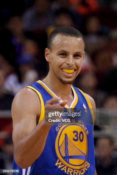 Stephen Curry of the Golden State Warriors reacts during a game against the Los Angeles Lakers during the 2013 Global Games at the MasterCard Center...