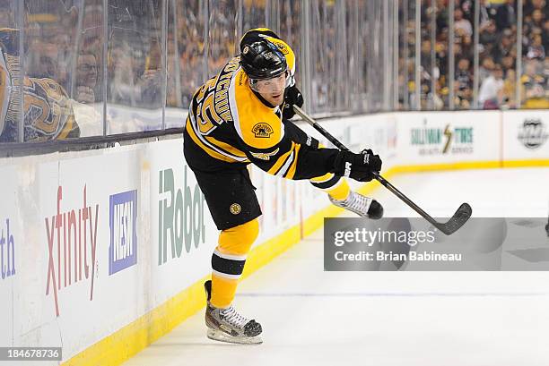 Johnny Boychuk of the Boston Bruins shoots the puck against the Colorado Avalanche at the TD Garden on October 10, 2013 in Boston, Massachusetts.