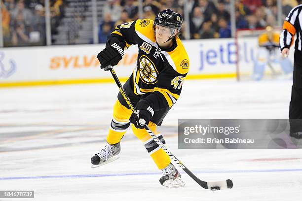 Torey Krug of the Boston Bruins shoots the puck against the Colorado Avalanche at the TD Garden on October 10, 2013 in Boston, Massachusetts.