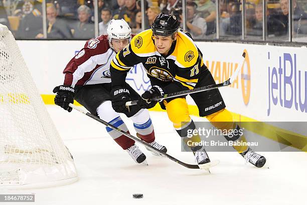 Milan Lucic of the Boston Bruins skates after the puck against Matt Duchene of the Colorado Avalanche at the TD Garden on October 10, 2013 in Boston,...