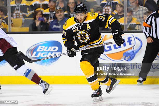 Patrice Bergeron of the Boston Bruins skates against the Colorado Avalanche at the TD Garden on October 10, 2013 in Boston, Massachusetts.