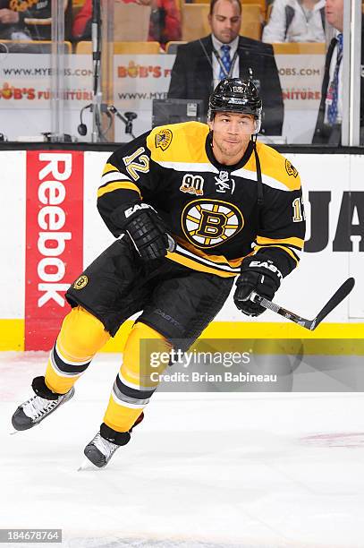 Jarome Iginla of the Boston Bruins skates during warm ups prior to the game against the Colorado Avalanche at the TD Garden on October 10, 2013 in...