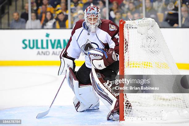 Jean-Sebastien Giguere of the Colorado Avalanche watches the play against the Boston Bruins at the TD Garden on October 10, 2013 in Boston,...