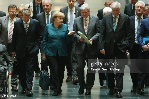 Leading members of the German Christian Democrats , including Chairwoman and German Chancellor Angela Merkel and Hesse Governor Volker Bouffier , as...