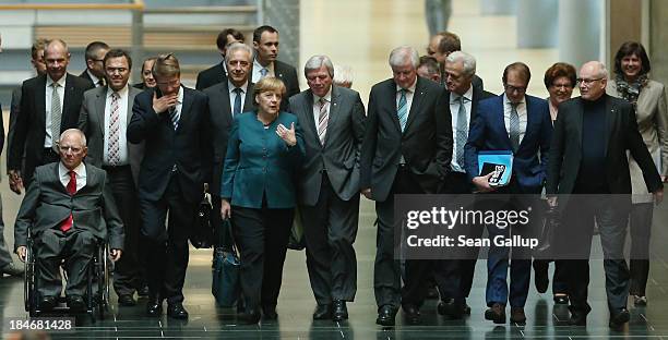 Leading members of the German Christian Democrats , including Chairwoman and German Chancellor Angela Merkel and Hesse Governor Volker Bouffier , as...