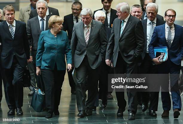Leading members of the German Christian Democrats , including Chairwoman and German Chancellor Angela Merkel and Hesse Governor Volker Bouffier , as...