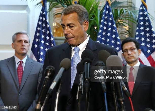 House Speaker John Boehner walks away while flanked by House Majority Leader Eric Cantor and Rep. Kevin McCarthy after speaking to the media folowing...