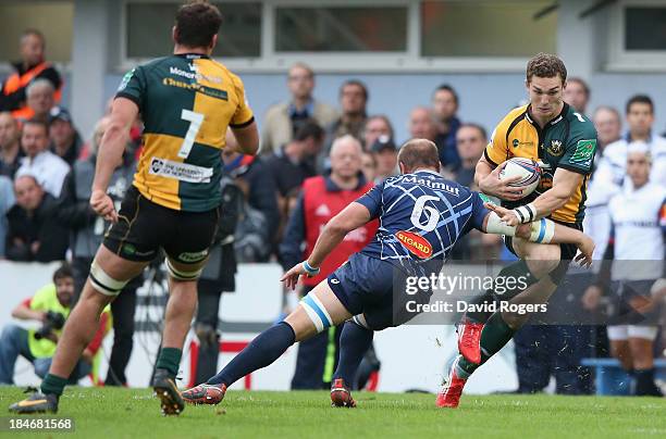 George North of Northampton is tackled byJan de Bruin Bornman during the Heineken Cup match between Castres and Northampton Saints at Stade Pierre...