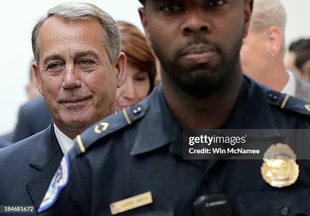 Speaker of the House Rep. John Boehner arrives at a press conference followiong a meeting of House Republicans at the U.S. Capitol October 15, 2013...