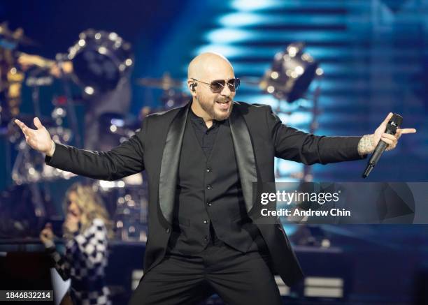 Pitbull performs on stage during The Trilogy Tour at Rogers Arena on December 10, 2023 in Vancouver, British Columbia, Canada.
