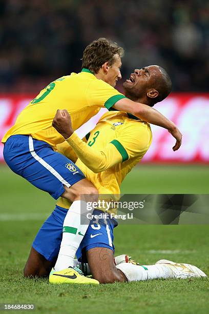 Silva Anderson of Brazil celebrates a goal with his teammate Leiva Lucas during the international friendly match between Brazil and Zambia at Beijing...