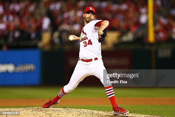 John Axford of the St. Louis Cardinals pitches against the Los Angeles Dodgers during Game One of the National League Championship Series at Busch...