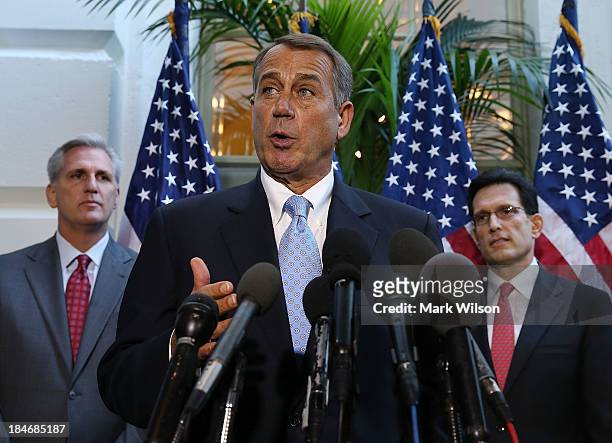 House Speaker John Boehner speaks to the media while flanked by House Majority Leader Eric Cantor and U.S. Rep. Kevin McCarthy folowing a House...