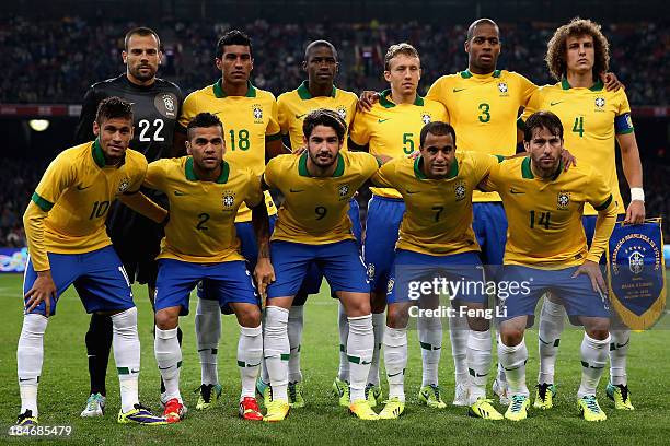 Brazil's football team players Neymar, Daniel, Alexandre, Lucas and Maxwell, goalkeeper Diego, Paulinho, Ramires, Lucas, Anderson and David line up...