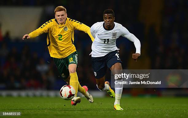 Wilfried Zaha of England battles with Povilas Kiselevshis of Lithuania during the 2015 UEFA European U21 Championships Qualifying Group One match...