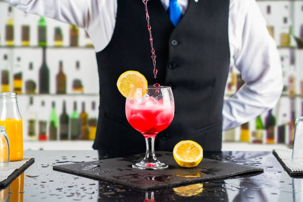 Bartender carefully crafting a cocktail