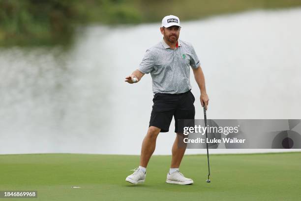 Louis Oosthuizen of South Africa acknowledges the crowd following a birdie putt on the 15th green on Day Five of the Alfred Dunhill Championship at...