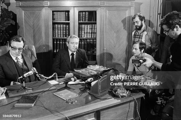 Paris prosecutor Christian Le Gunehec and Serge Devos , head of the Brigade de répression du banditisme, present pieces of tape found at the home of...