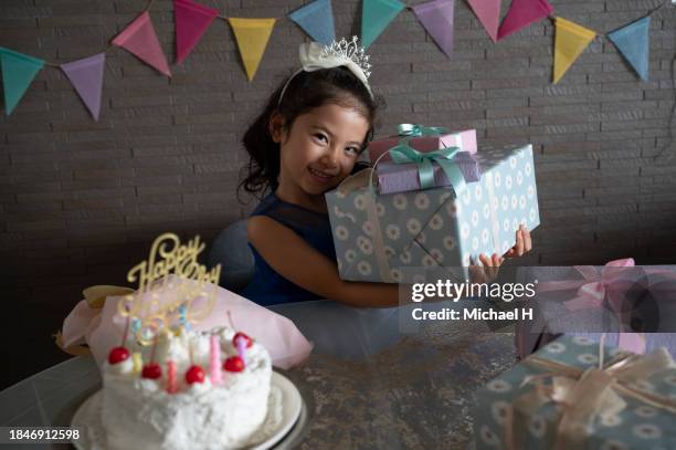 girl holding a birthday party in the living room - boy tiara stock pictures, royalty-free photos & images