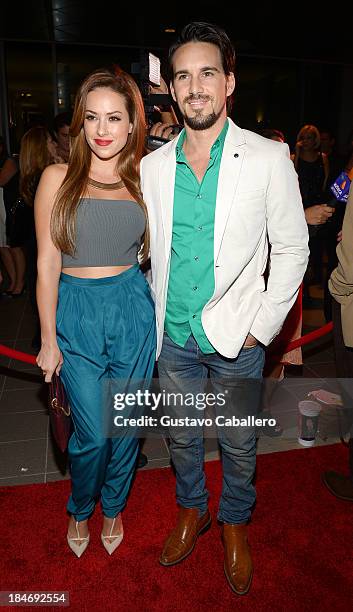 Sofia Lama and Leonardo Reyes arrives for the premiere of "The Snitch Cartel" at Regal South Beach on October 14, 2013 in Miami, Florida.