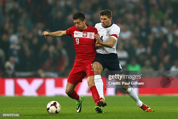 Robert Lewandowski of Poland battles with Steven Gerrard of England during the FIFA 2014 World Cup Qualifying Group H match between England and...
