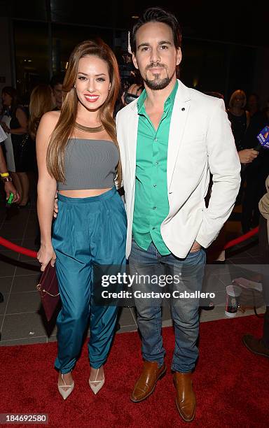 Sofia Lama and Leonardo Reyes arrives for the premiere of "The Snitch Cartel" at Regal South Beach on October 14, 2013 in Miami, Florida.