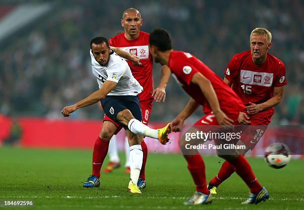 Andros Townsend of England shoots past the Poland defence during the FIFA 2014 World Cup Qualifying Group H match between England and Poland at...
