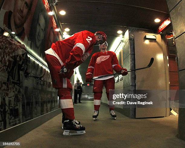 Drew Miller of the Detroit Red Wings and teammate Cory Emmerton stand in the cooridor before warm-ups prior to a NHL game against the Phoenix Coyotes...