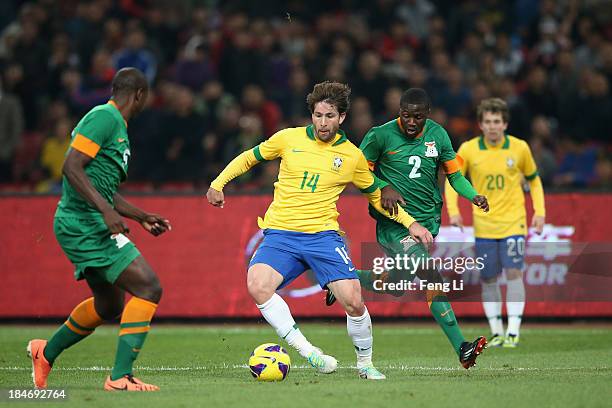 Anderson Maxwell of Brazil competes the ball with Jimmy Chisenga of Zambia during the international friendly match between Brazil and Zambia at...