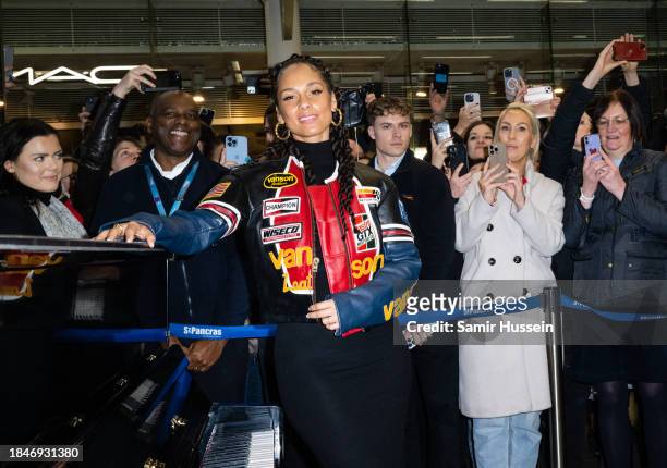 Performs on the Sir Elton John piano at St Pancras International Station on December 11, 2023 in London, England.