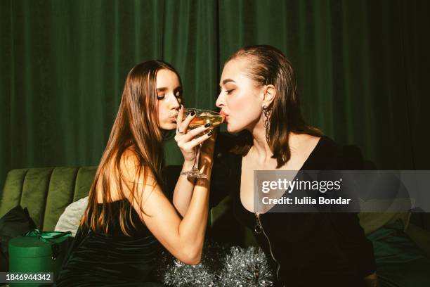 two young women celebrating new year's eve - two year anniversary party stock pictures, royalty-free photos & images