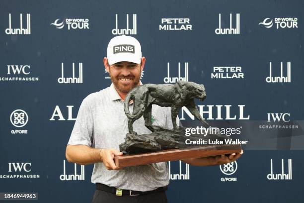 Louis Oosthuizen of South Africa poses with the Alfred Dunhill Championship trophy on Day Five of the Alfred Dunhill Championship at Leopard Creek...