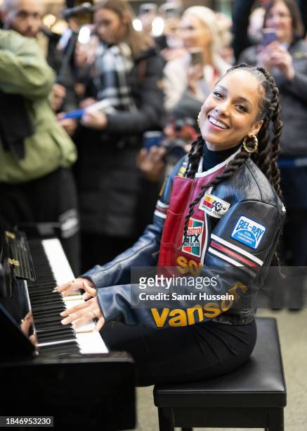 Alicia Keys performs on the Sir Elton John piano at St Pancras International Station on December 11, 2023 in London, England.