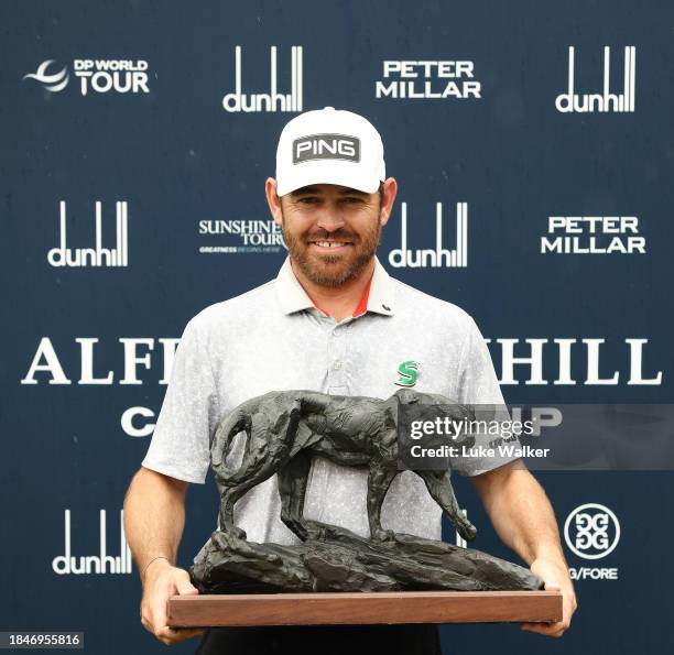 Louis Oosthuizen of South Africa poses with the Alfred Dunhill Championship trophy on Day Five of the Alfred Dunhill Championship at Leopard Creek...