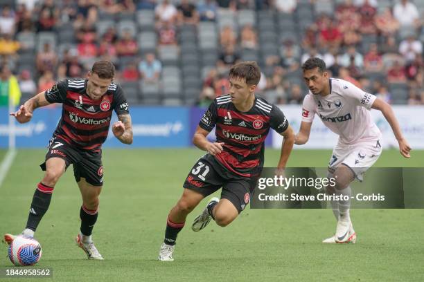 Aidan Simmons of the Wanderers looks on at teammate Dylan Pierias during the A-League Men round seven match between Western Sydney and Melbourne...