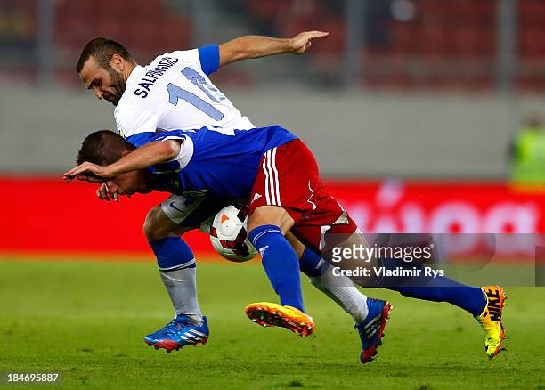 Dimitris Salpigidis of Greece and Sandro Wieser of Liechtenstein battle for the ball during the group G FIFA 2014 World Cup Qualifier match between...