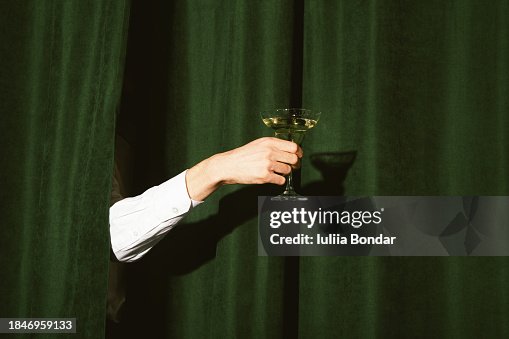 Hand with a martini glass Hand with a martini glass