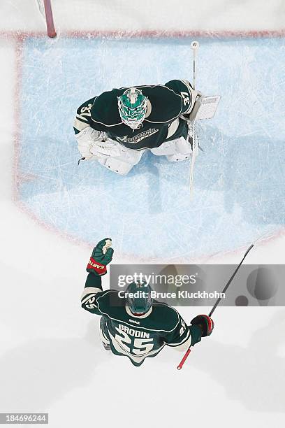 Jonas Brodin and goalie Josh Harding of the Minnesota Wild celebrate after defeating the Winnipeg Jets on October 10, 2013 at the Xcel Energy Center...