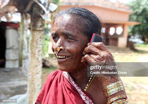 Local Woman joyfully shares the news of well being with her relatives after the cyclone Phailin on October 14, 2013 in Srikakulam, India. Cyclone...