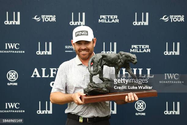 Louis Oosthuizen of South Africa poses with the Alfred Dunhill Championship trophy on Day Five of the Alfred Dunhill Championship at Leopard Creek...