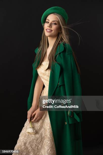 photo of young beautiful happy smiling woman wearing stylish - green coat 個照片及圖片檔