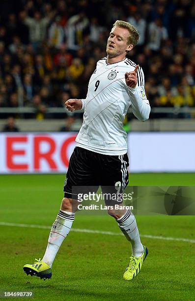 Andre Schuerrle of Germany celebrates after scoring his teams fourth goal during the FIFA 2014 World Cup Qualifying Group C match between Sweden and...