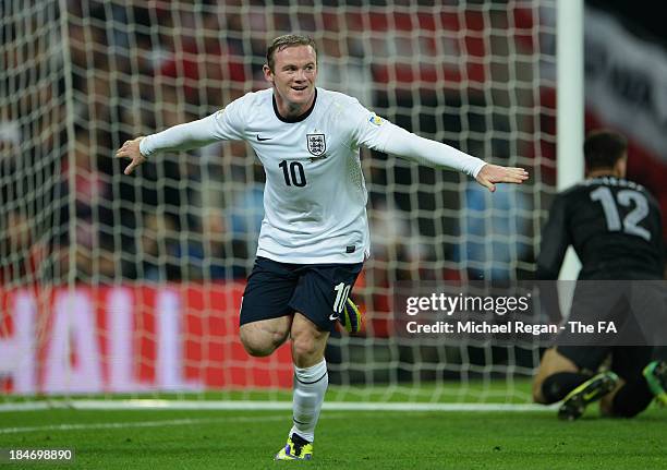 Wayne Rooney of England celebrates scoring their first goal during the FIFA 2014 World Cup Qualifying Group H match between England and Poland at...