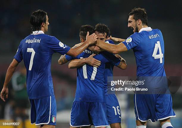 Alessandro Florenzi of Italy celebrates with his team-mates after scoring their first goal during the FIFA 2014 World Cup qualifier group B match...