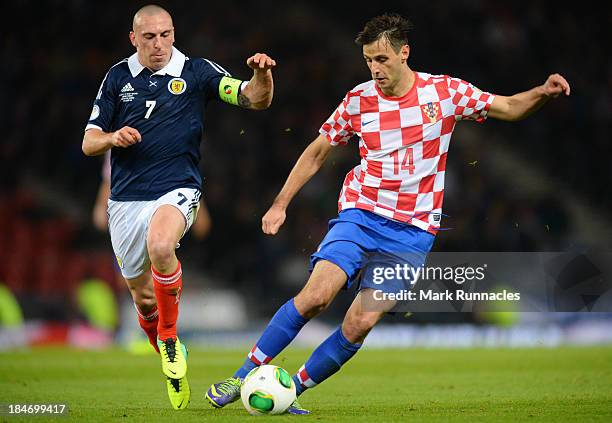 Scott Brown of Scotland battles with Nikola Kalinic of Croatia during the FIFA 2014 World Cup Qualifying Group A match between Scotland and Croatia...