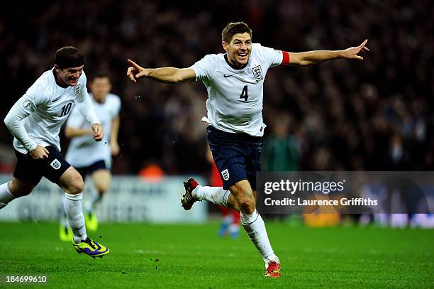 Steven Gerrard of England celebrates as he scores their second goal during the FIFA 2014 World Cup Qualifying Group H match between England and...