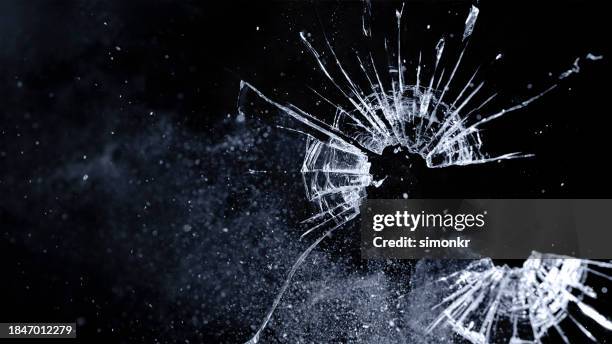 close-up of bullet hole on glass - smoking crack stock pictures, royalty-free photos & images