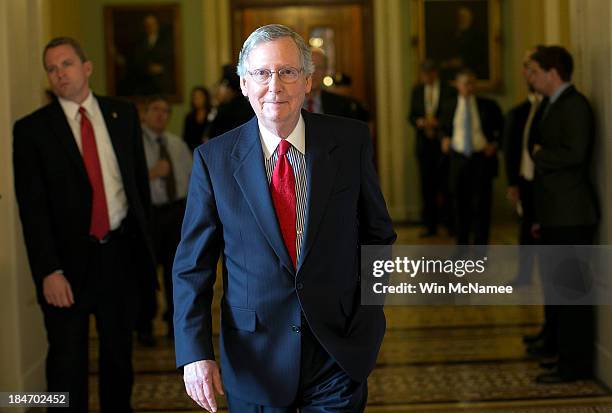 Senate Minority Leader Mitch McConnell returns to his office after a meeting of Senate Republicans at the U.S. Capitol October 15, 2013 in...