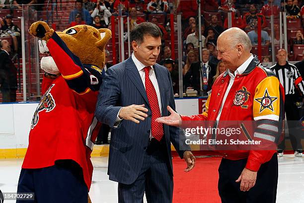 Florida Panthers new owner Vincent Viola and Original team owner H. Wayne Huizenga shake hands on the ice prior to the start of the game between the...